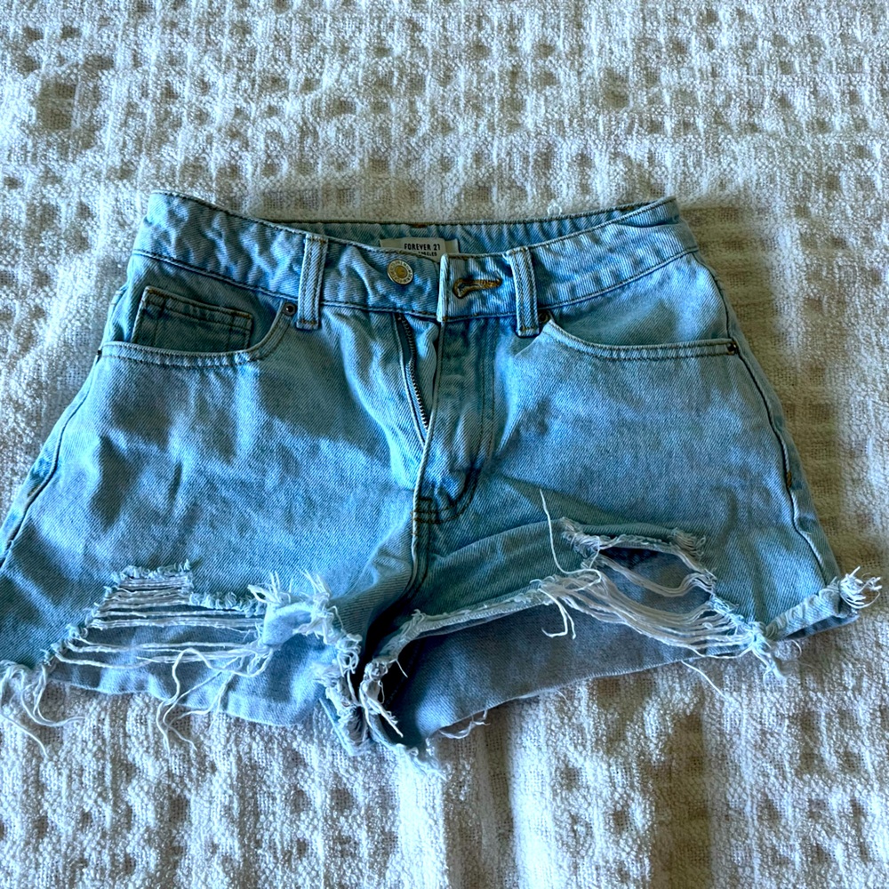 Light blue denim distressed denim jean shorts
